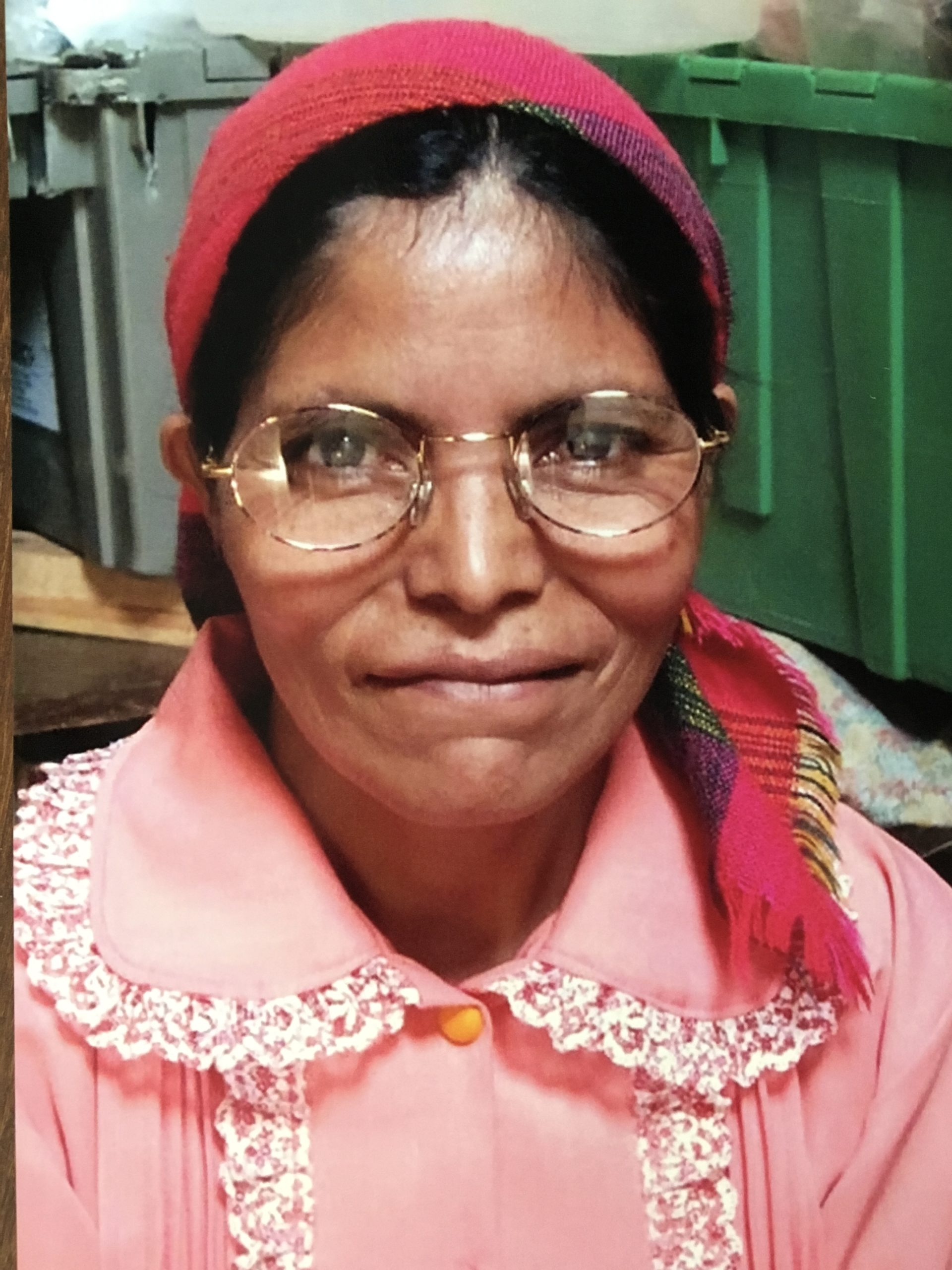 Lady in pink wearing new eyeglasses
